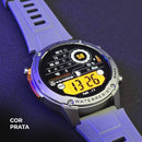 Smartwatch BRAVE prata com pulseira lilás exibindo watchface digital laranja